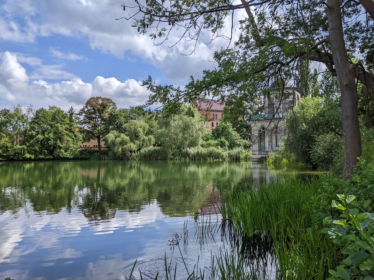 A park scenery with water, green and architecture in Potsdam.
